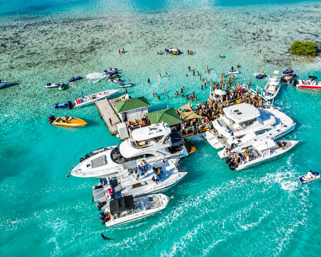 Aerial Tropical Sandbar Boat Party